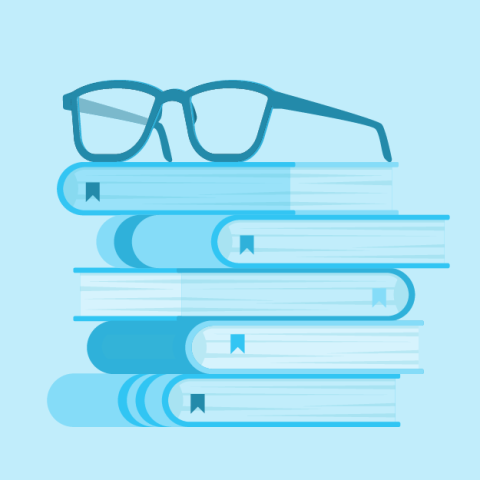 stack of books with pair of eyeglasses set on top